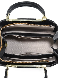 Vertical top view of black leather handbag with spacious multi-compartment interior layout