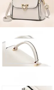 Détails de sac à bandoulière en cuir crème avec boucles dorées et rabat brodé
