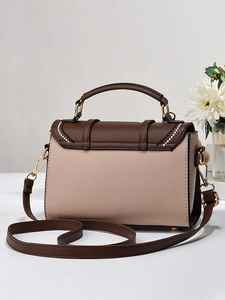 Sac à main en cuir PU bicolore marron et beige avec bandoulière et pompon décoratif