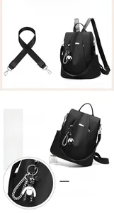 Detail view of water-resistant black oxford backpack with removable strap and bear charm