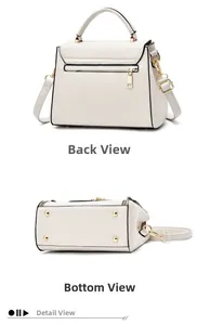 Détails de la poche zippée arrière et des pieds de protection dorés du sac crème