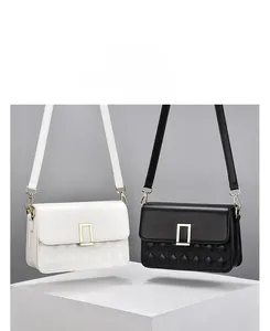Detailed view of quilted faux leather shoulder bags with elegant metal twist locks