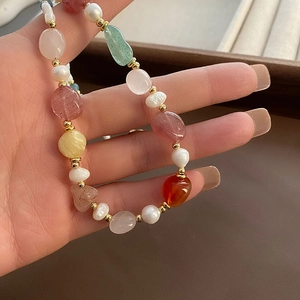Handmade necklace with colorful natural gemstones, baroque pearls and gold beads