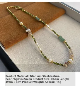 Detail of vintage pearl necklace with green agate beads and titanium steel clasp