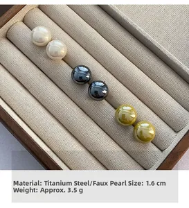 Three pairs of 1.6cm titanium steel pearl earrings in white, grey, and olive green colors