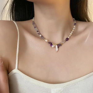 Baroque pearl necklace with purple natural stones and 18K gold beads on a model