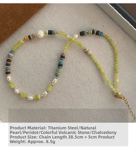 Detail of beaded necklace with peridot, pearls and volcanic stones on jewelry tray