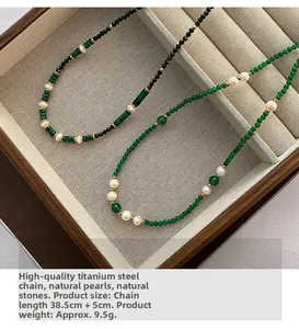 Detail of beaded necklace featuring natural pearls and stones on titanium steel chain
