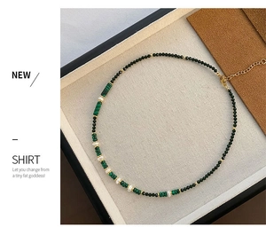 Detail of malachite, pearl and bead necklace with gold adjustable lobster clasp