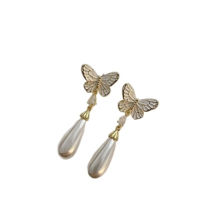 Elegant butterfly drop earrings with white enamel wings and pear-shaped pearl pendants