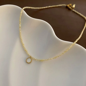 French style titanium steel necklace with yellow faceted beads and white shell pendant