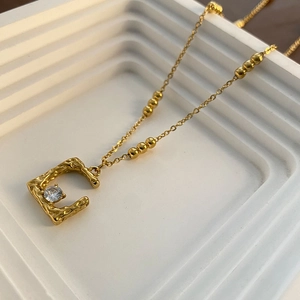 Vintage irregular gold square pendant necklace with hammered texture and clear zircon
