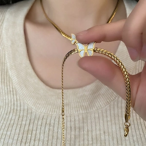 Elegant gold titanium necklace and bracelet set with white butterfly shell pendants