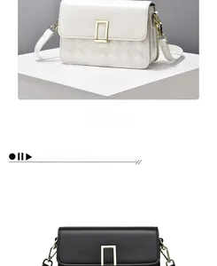 Detail of quilted crossbody bag featuring large gold square buckle and chain strap