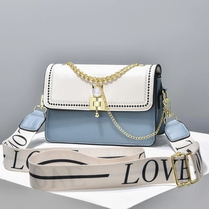 Blue and white color-block crossbody bag with gold chain and LOVE strap