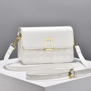 Classic white quilted crossbody bag with golden buckle and adjustable strap