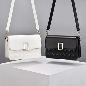 Classic quilted crossbody bag in black and white leather with gold hardware lock