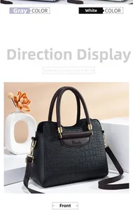 Close-up of black tote bag featuring embossed crocodile pattern and gold Miaoshi hardware