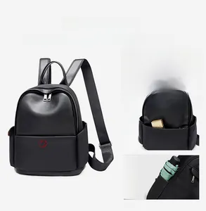 Detail view of the multi-pocket storage system and anti-theft design on black backpack