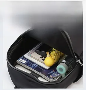 Top view of spacious black backpack interior featuring a laptop compartment and main pocket