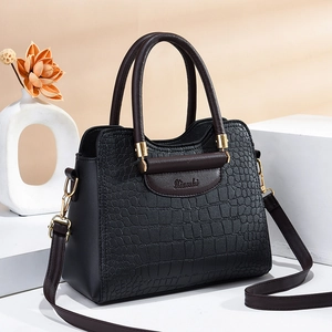Elegant black crocodile texture handbag with gold hardware and vintage top handle