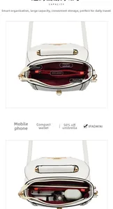 Internal layout of white leather crossbody bag showing dual main compartments and zipper pocket