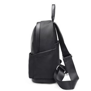 Minimalist black lightweight backpack for women with side pockets and adjustable straps