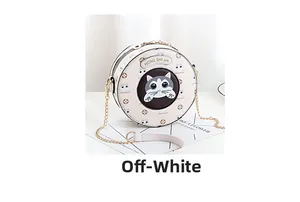 Detail of a beige round crossbody bag featuring cute cartoon cat patterns and metal chain