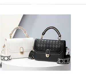 Close-up of diamond quilted texture and golden twist lock on stylish crossbody handbags