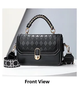 Detail of black quilted leather handbag with gold U-lock and patterned woven strap