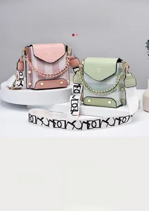 Close-up of pleated leather mini bags with jacquard straps and metallic bow details