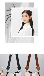 Detail of minimalist bucket bag featuring lychee grain leather and wide fabric strap