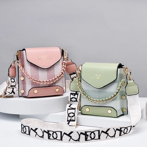 Mini crossbody phone bags in pink and green leather with stylish wide woven straps