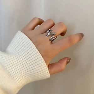Irregular silver molten style stainless steel open ring with minimalist fluid wave design