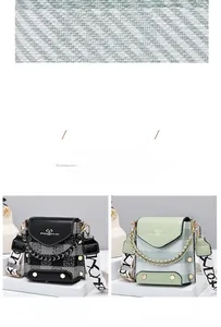 Detail of crossbody bag with chain accent, wide lettered strap and hex rivet hardware