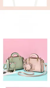 Detail view of stylish pastel tote bags with cute cat-shaped coin purse charms