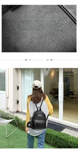 Detail of black lychee texture PVC backpack with golden rivets and quilted pocket