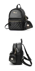 Detail of black pebbled leather backpack with gold rivets and diamond quilt stitching