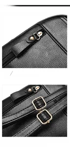 Detail of lychee pattern leather bag showing quality metal zipper and adjustable buckle