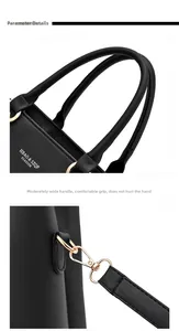 Detail des runden Griffs mit goldener Hardware und Logo an schwarzer Kunstledertasche