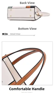 Detail view of stitched tote bag bottom with metal feet and comfortable brown handle