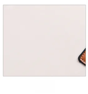 Detailed macro of premium lychee pattern faux leather with neat white stitching
