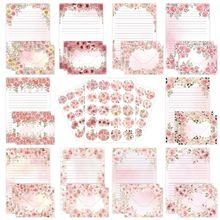 Detailed view of pink floral stationery set with lined letter paper, envelopes, and stickers
