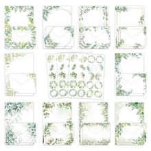Detailed set of botanical stationery featuring green leaf illustrations and matching envelopes