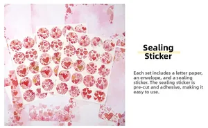 Detail of pink heart-shaped sealing stickers for romantic wedding stationery sets