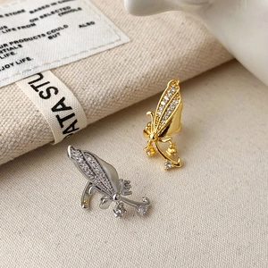 Elegant gold and silver butterfly ear cuffs with micro-paved cubic zirconia accents