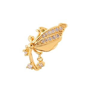Elegant gold butterfly wing ear cuff with shimmering micro-set cubic zirconia on white background