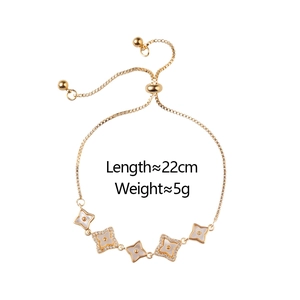 Adjustable gold clover bracelet with mother-of-pearl and pavé zircon stones on white background