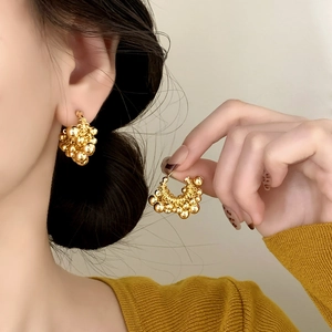 Fashionable gold-plated cluster stud earrings featuring polished metallic sphere design
