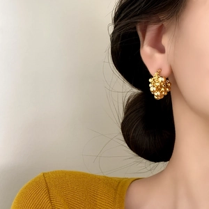 Chic 18K gold plated cluster bead earrings worn by a model with a stylish vintage look